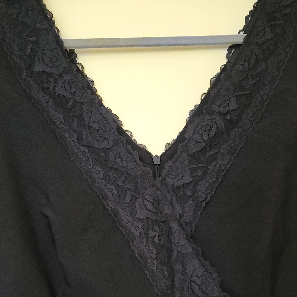 Vintage black sheath dress with lace neckline